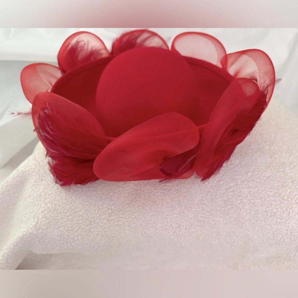 David M Vintage Women’s Red wood hat. Crown covered w/coque, feathers.